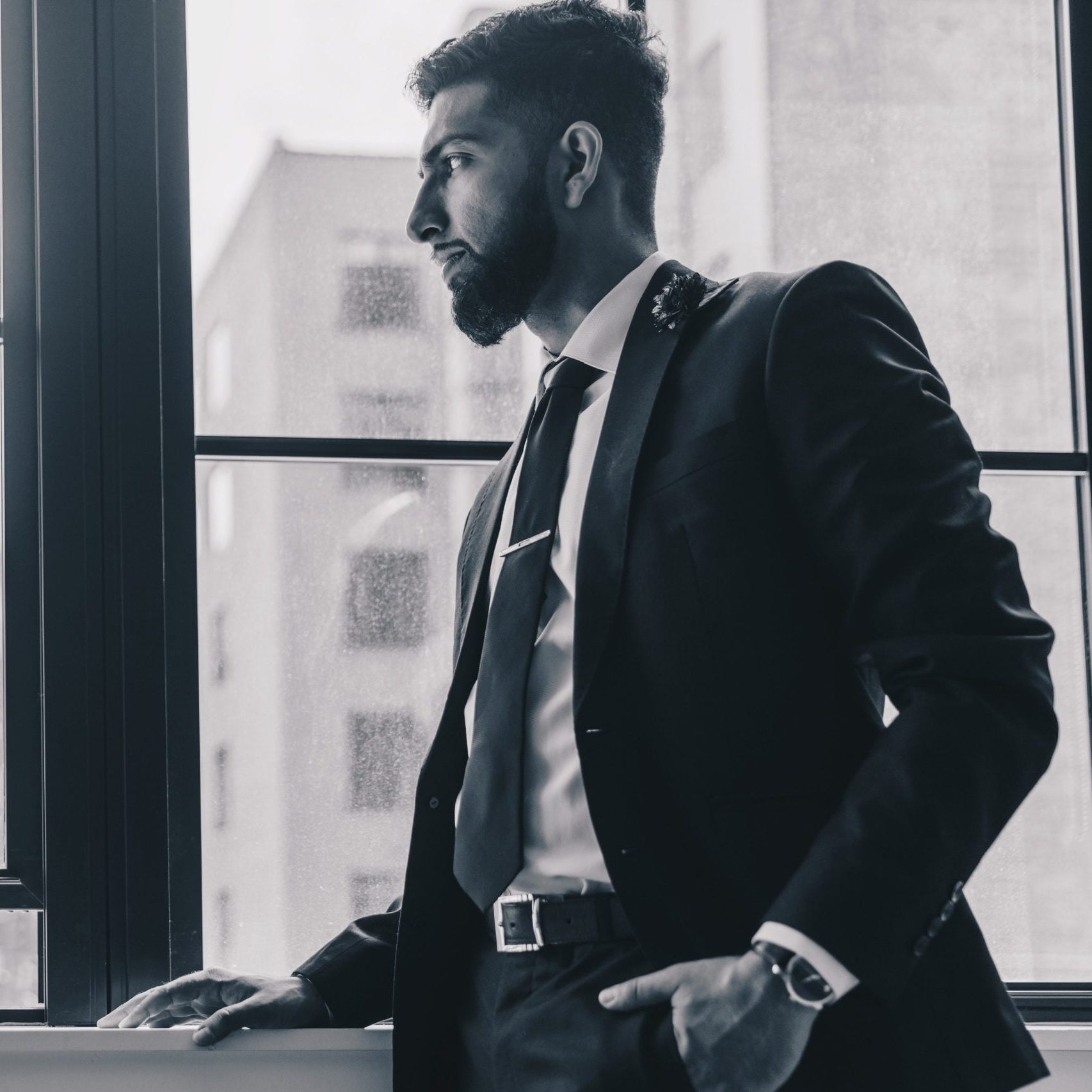 man-in-suit-thinking-scaled-e1748608158646.jpg